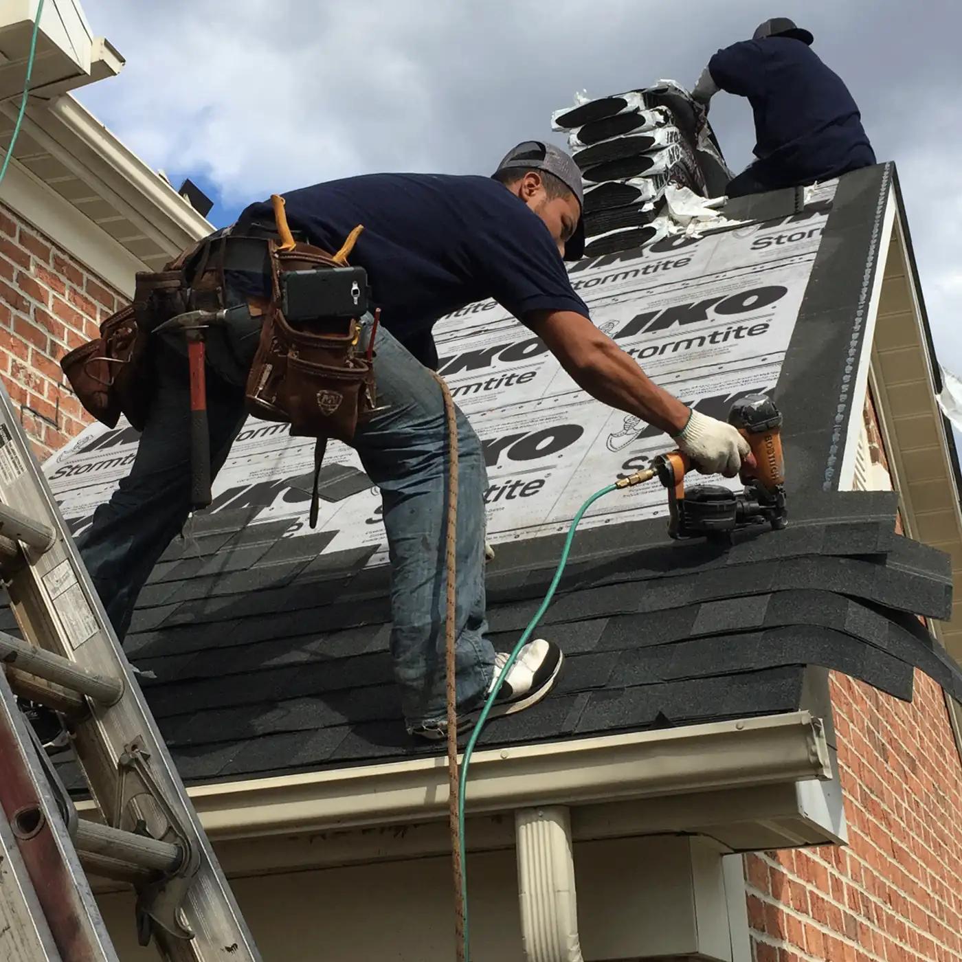 Coastal Craft Roofing crew installing shingles on an Alberta roof