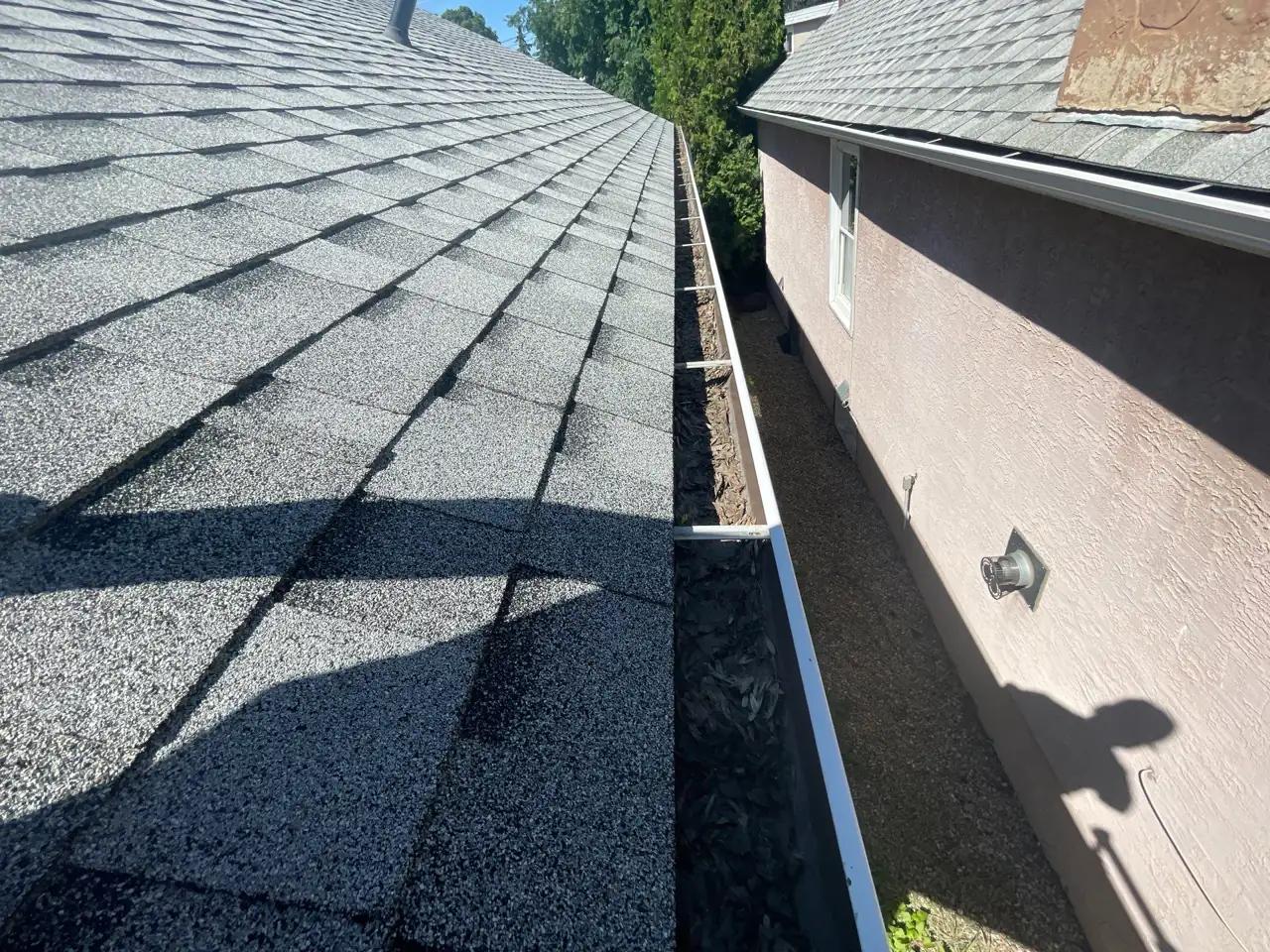 Cleaned-out gutter running along the roofline of an Edmonton home