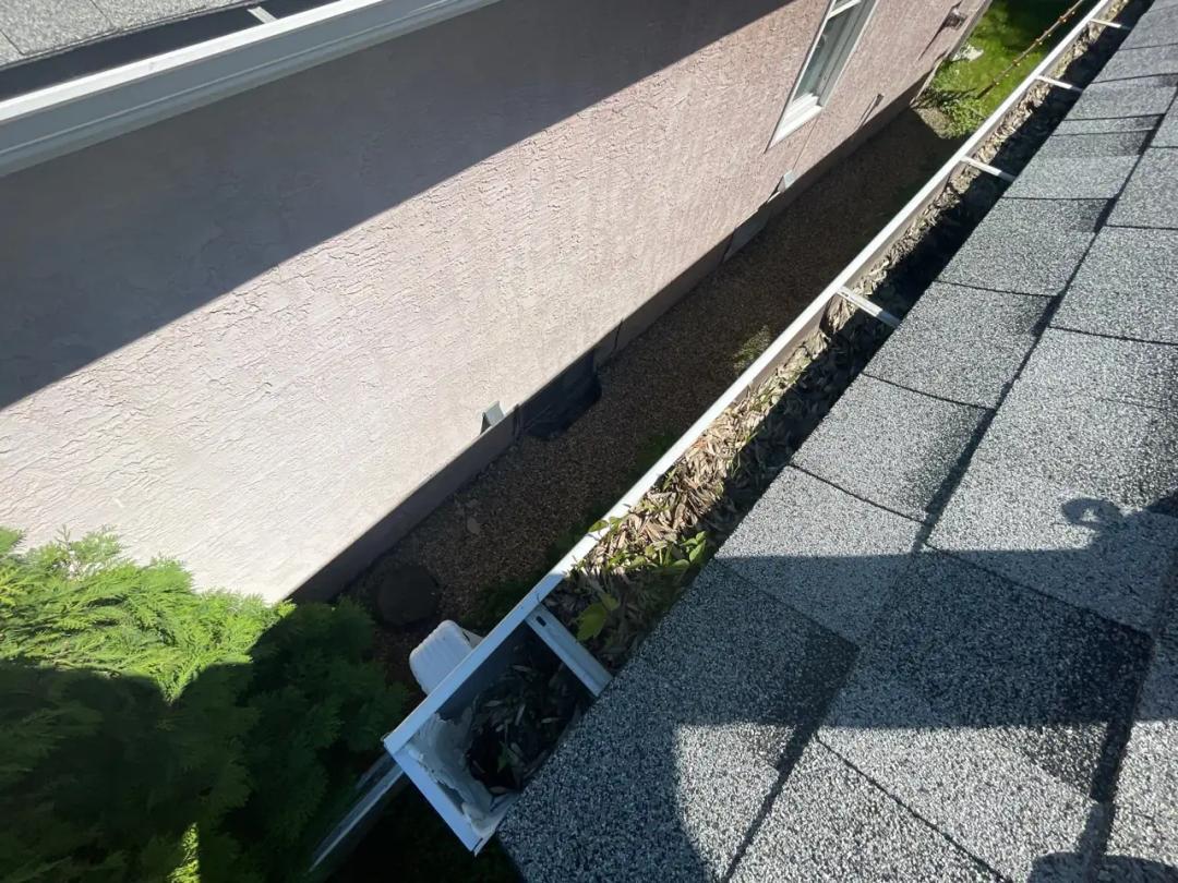 Gutter and roof edge checked for proper flow
