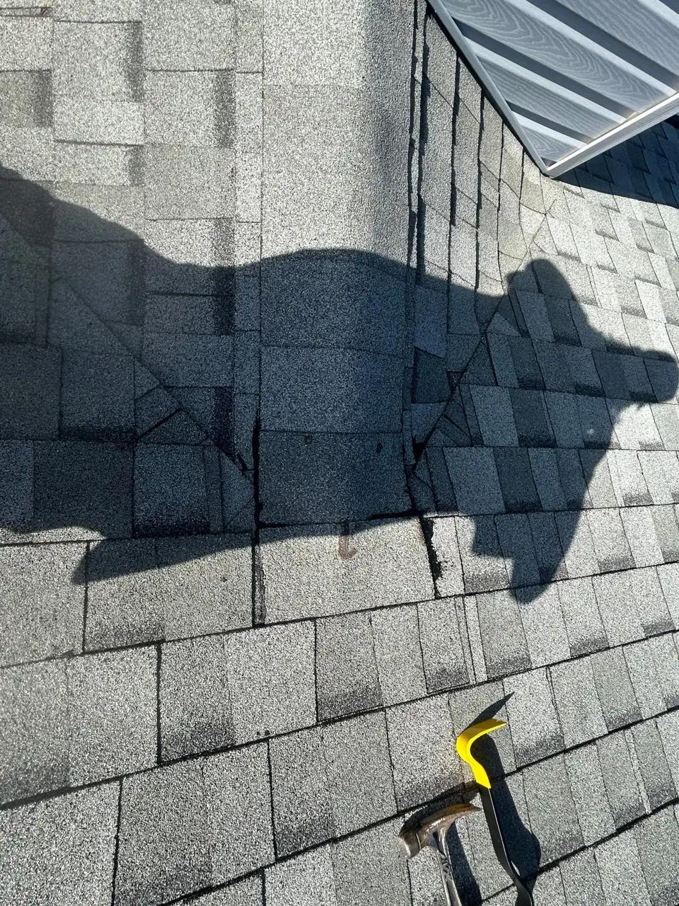 Inspecting the shingles and a roof valley up close