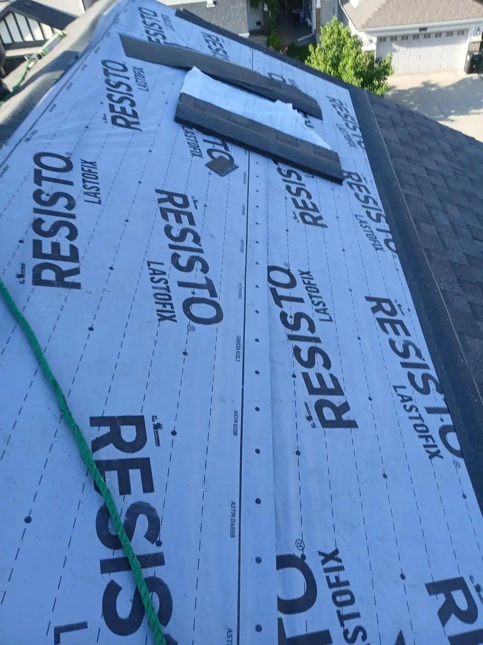 New shingles being installed over the underlayment