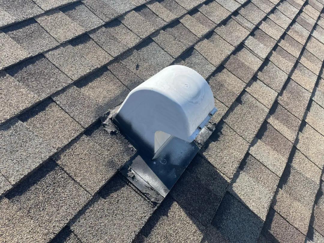The failed roof vent on the shingles — the real source of the leak