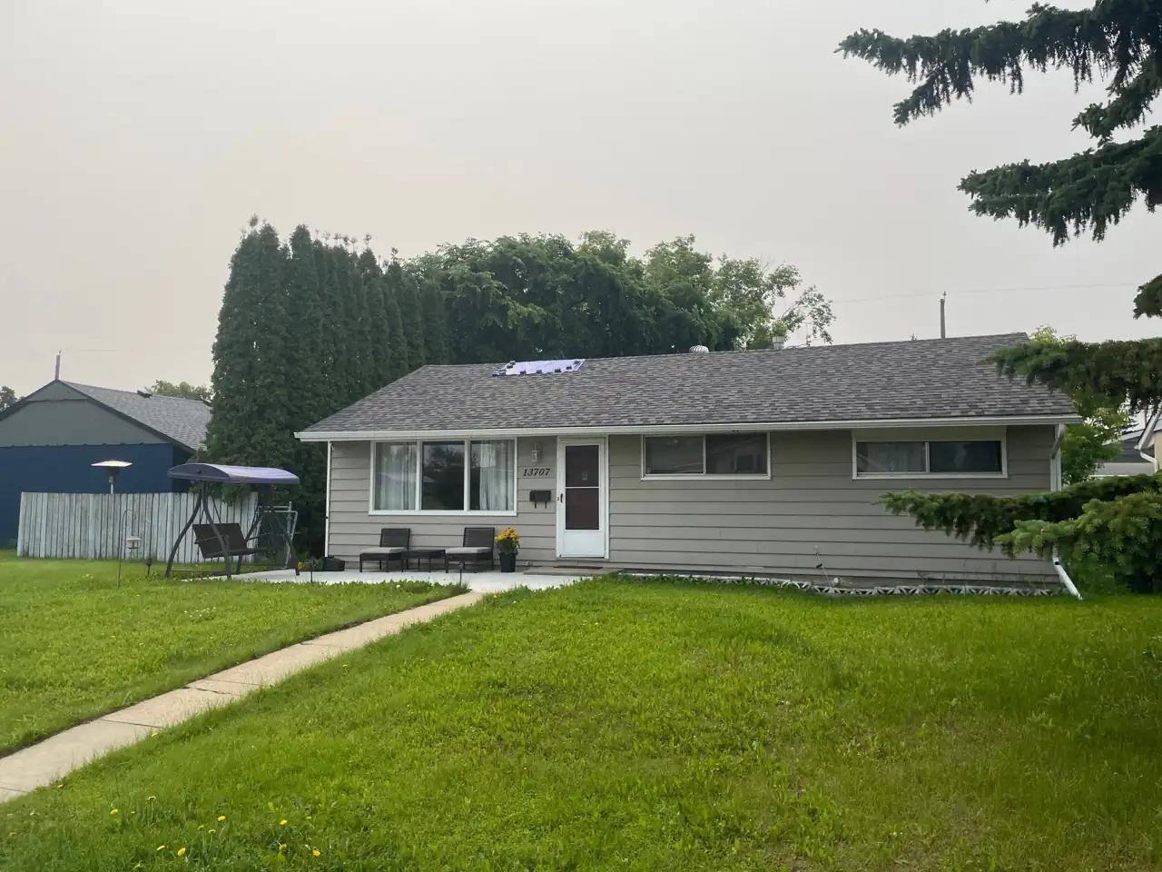 Roof in northwest Edmonton where wind-blown shingles were matched and replaced