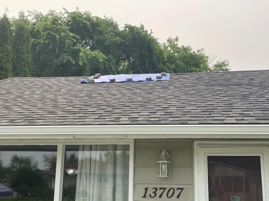 Lifted and blown-off shingles from wind