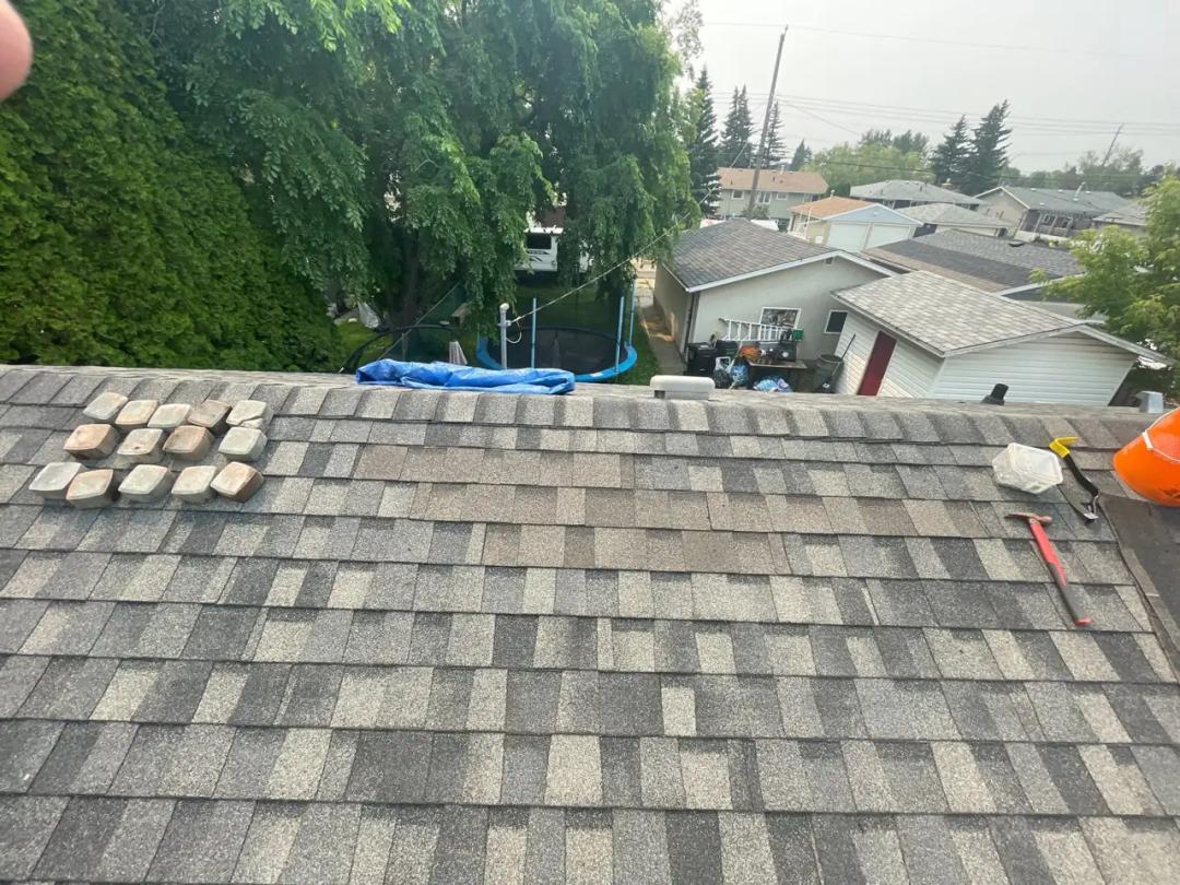 New shingles installed and being sealed