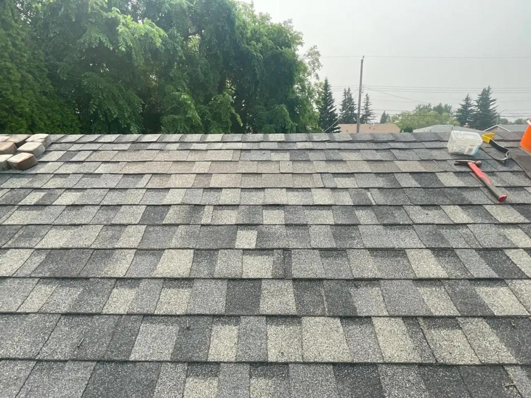 Completed shingle repair, roof closed to the weather