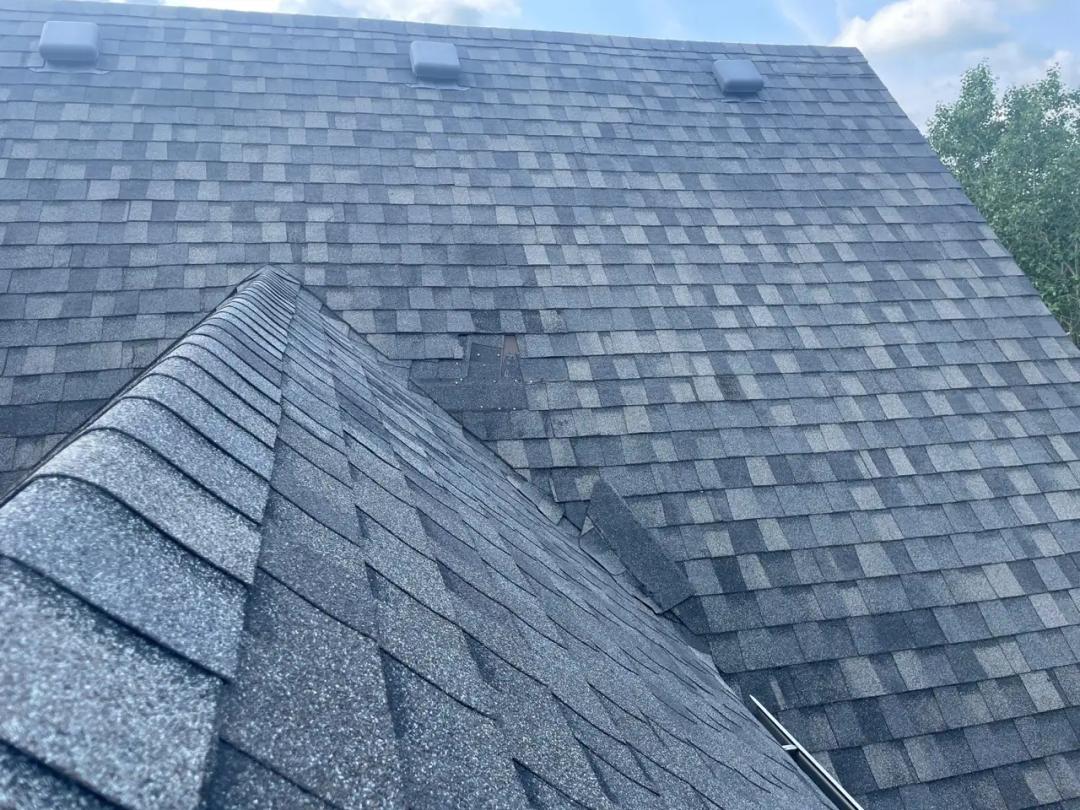 Blown-off shingles leaving the roof exposed