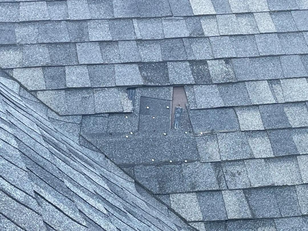 Installing new shingles to match the roof