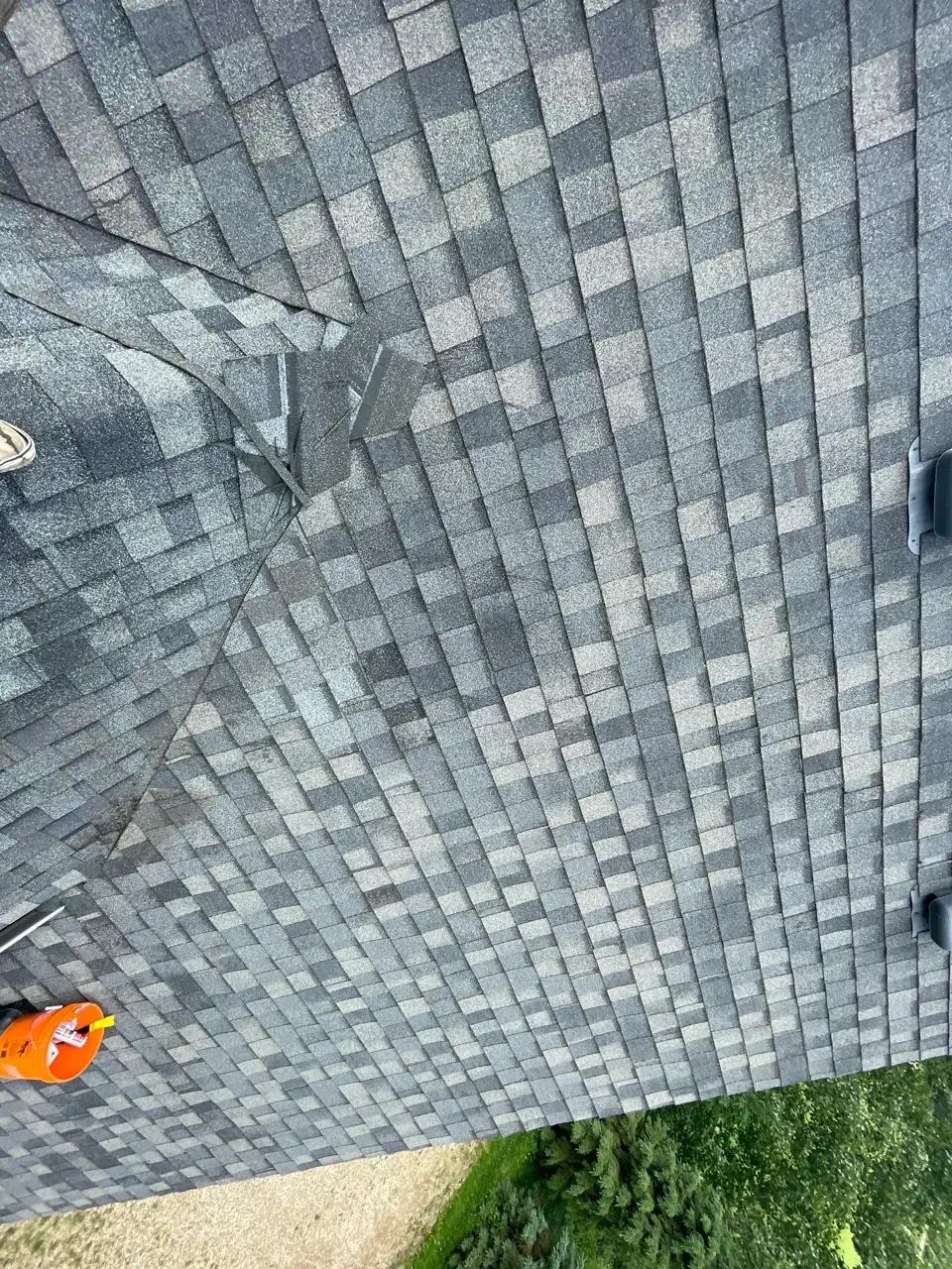 Repaired shingle section blended into the roof
