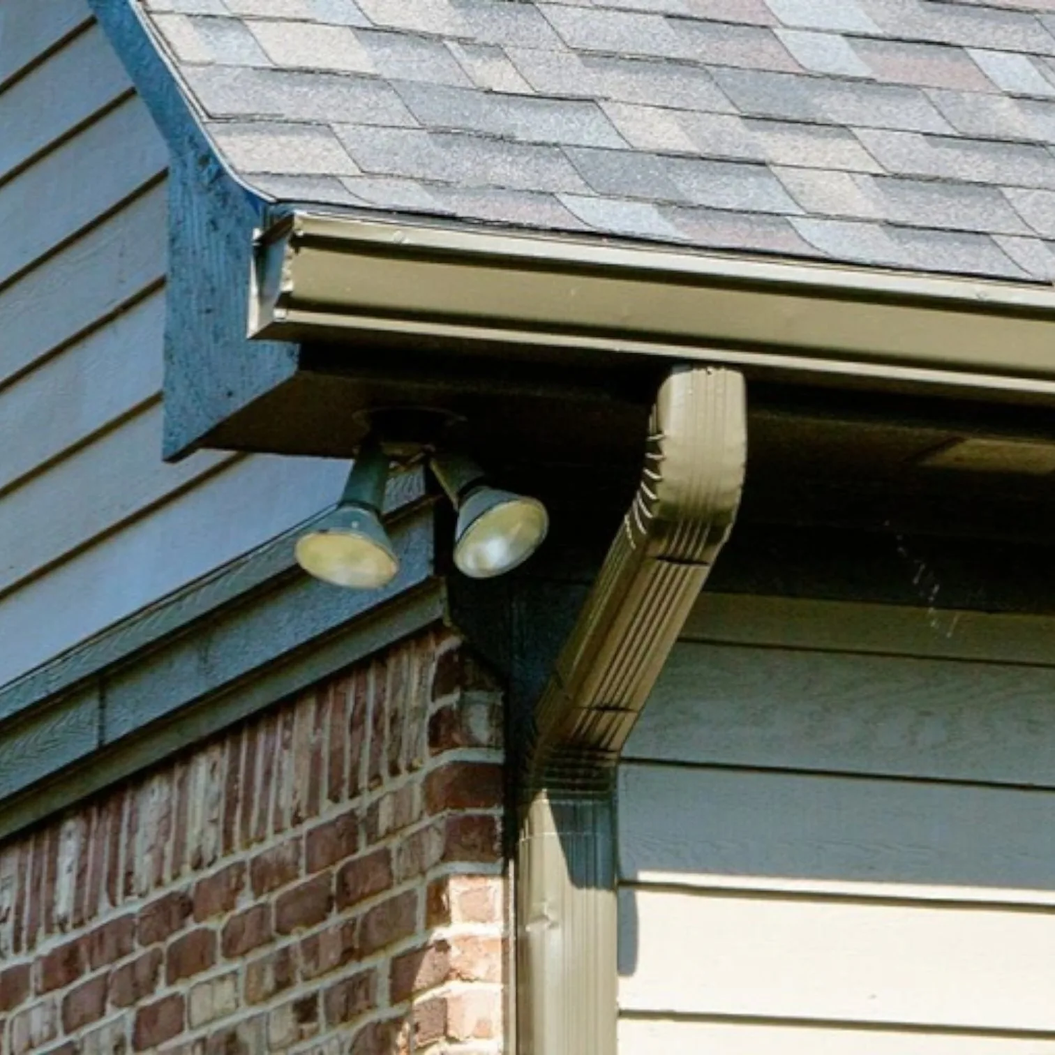 Gutter and downspout work on a residential home
